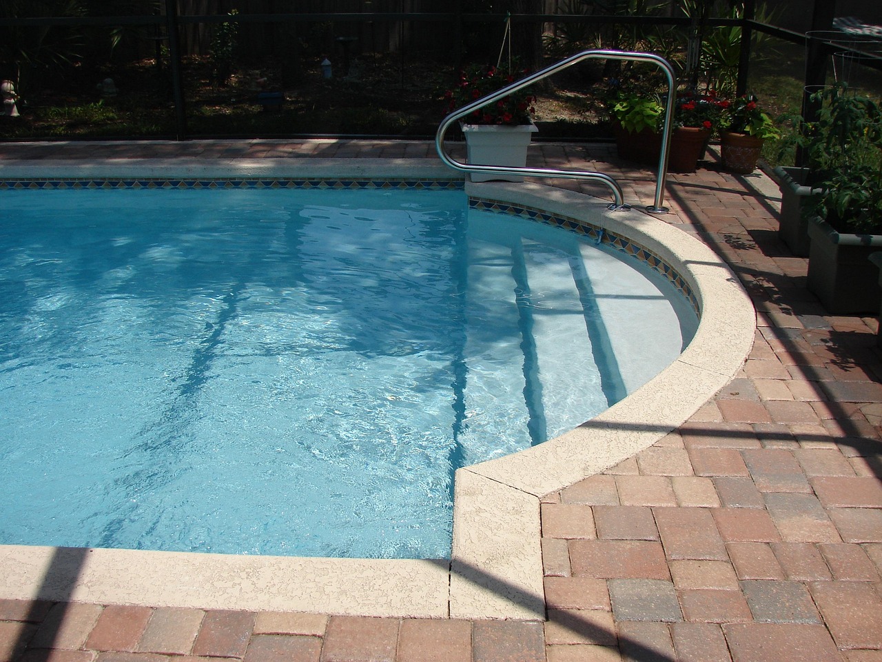 Spillover spa and sheer-descent waterfall on a custom Cape Coral pool